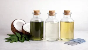Neem, coconut, and herbal oils displayed in glass bottles with a lice comb, commonly used in Pakistan for routine scalp care